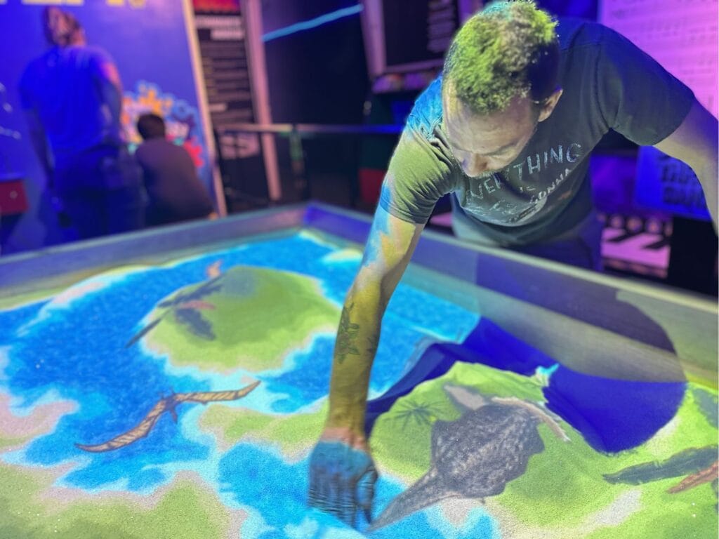 sand and projection exhibit WonderWorks Orlando - image by Dani Meyering