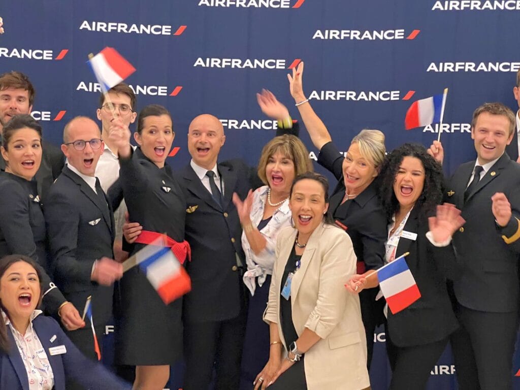 Air France new MCO nonstop flights to Paris group poses for celebration - image by Kelsey Glennon