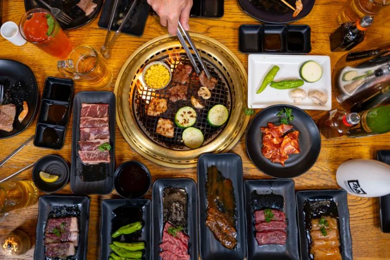 Mixed proteins on the grill with veggies drinks at Gyu-Kaku Orlando date night