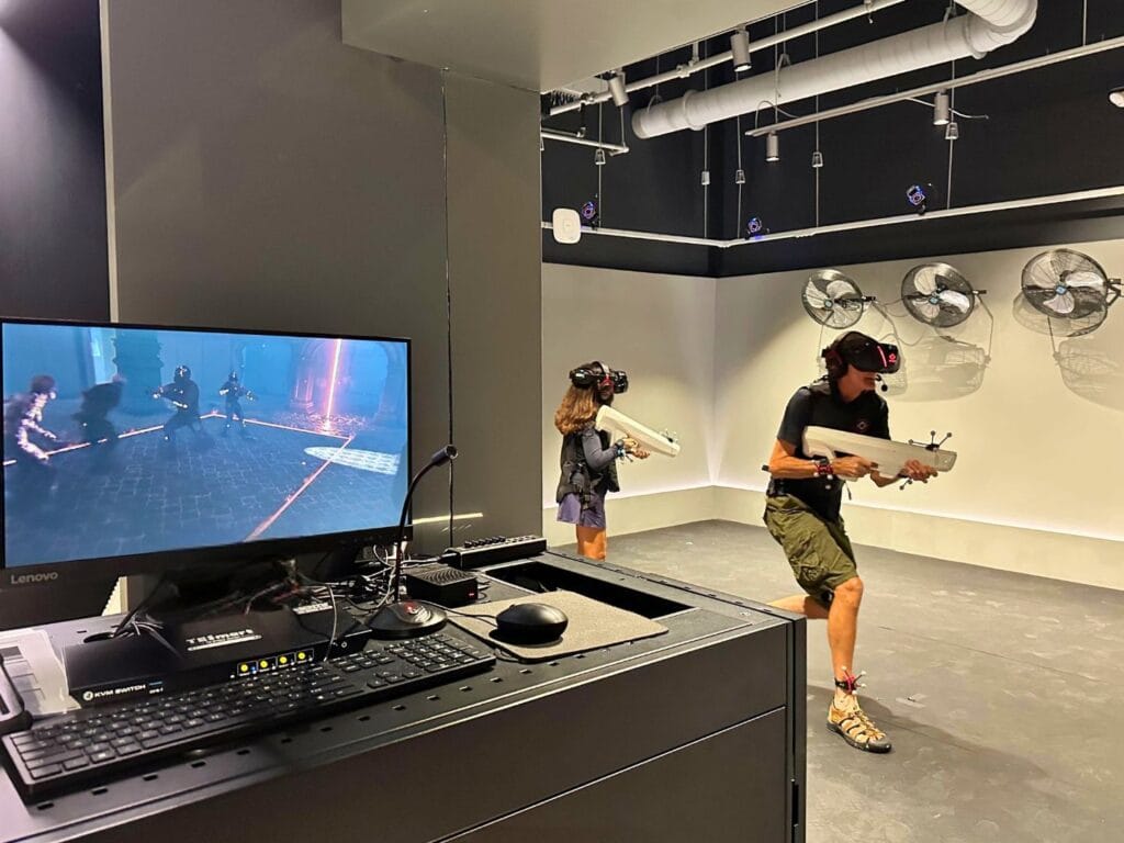 Two adults inside game bay at SandboxVR Orlando - image by Dani Meyering