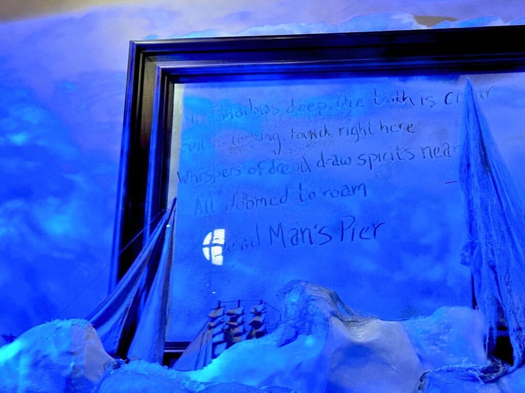Frozen themed mirror and message about Dead Man's Pier Thirsty Fish Bar at Loews Portofino Bay Resort - image by Dani Meyering