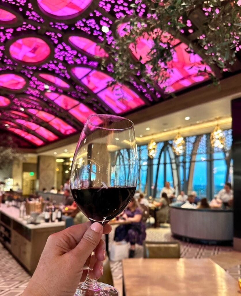 Toledo Rooftop Restaurant at Coronado Springs wine glass and dining room - image by Dani Meyering