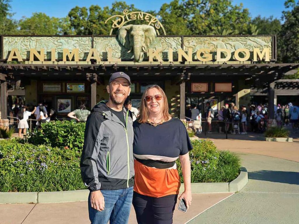 Disney adults couple pose in front of Animal Kingdom  - image by Disney PhotoPass for Dani Meyering