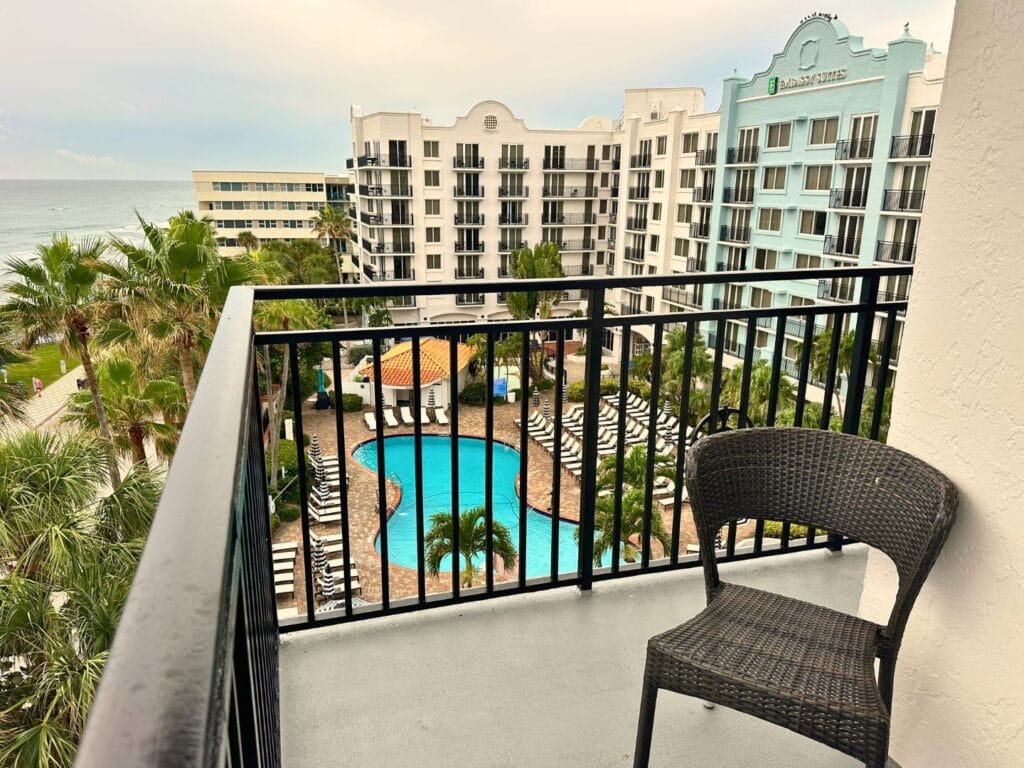 Balcony of King Suite at Embassy Suites Deerfield Beach overlooking pool - image by Dani Meyering