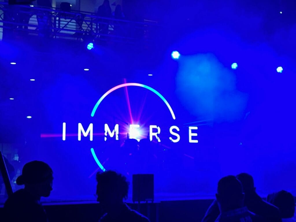 IMMERSE Downtown Orlando logo on stage - image by Dani Meyering