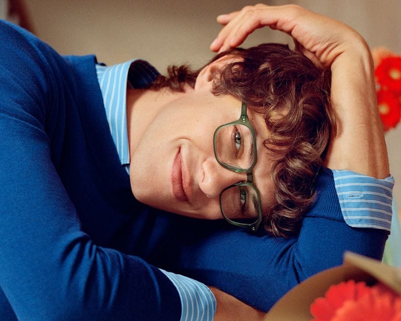 man smiling wearing glasses by Warby Parker