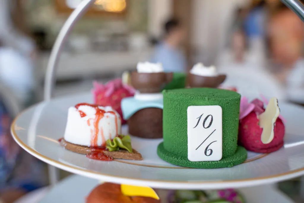 Disney Tea Experience three tiers with Alice in Wonderland desserts on top