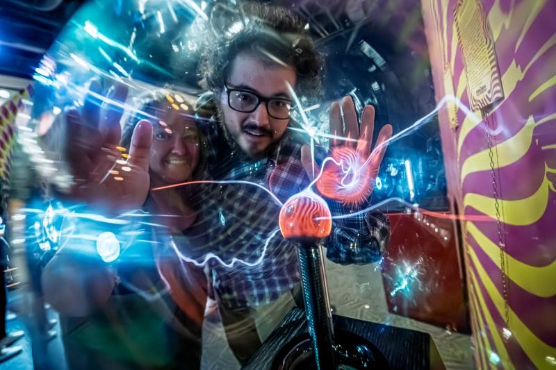 a couple playing with electricity at Orlando Science Center's Science Night Live!