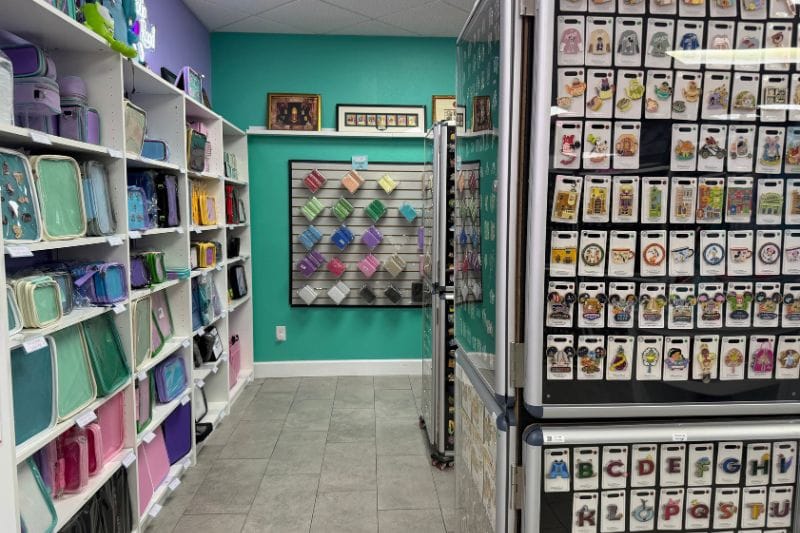 The interior of Pin HQ, featuring Disney pins, PinFolio boards, and PinFolio bags.